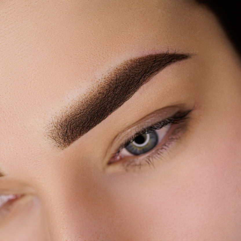 Permanent eyebrow makeup in the powder technique. Close-up eyebr